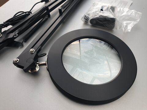 Black Magnifying Lamp with Adjustable Swing Arm and Clamp Mount