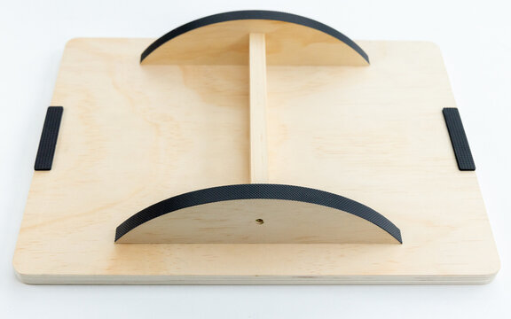 Wooden Wobble Balance Board with Black Grips on White Background