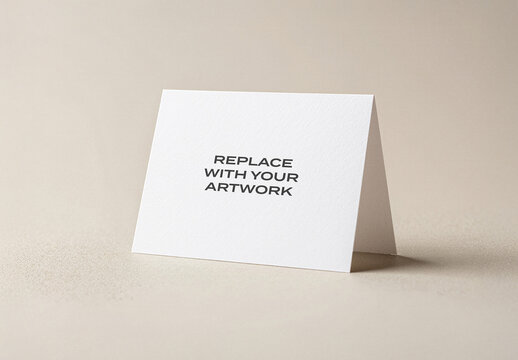 Folded card mockup standing upright on a neutral surface, realistic stationery presentation with text placeholder, clean design template for branding or print