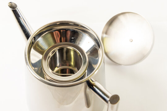 Stainless Steel Teapot with Infuser and Lid on White Background