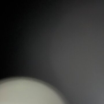 Abstract dark gradient background with soft glowing light