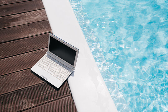 Remote Work by the Swimming Pool with Laptop Mockup