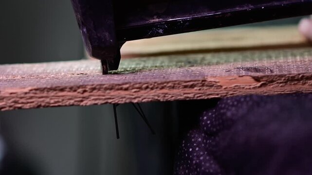 shooting nails in to pallet wood, close up video, power tool in use, woodworking close up of nail going in to the material, authentic b roll video