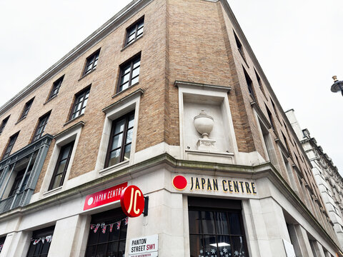 Japan Centre storefront at the corner of Panton Street in London UK with brick facade
