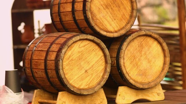 Three wooden barrels stacked on top of each other