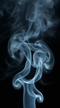White smoke swirling on black background close up