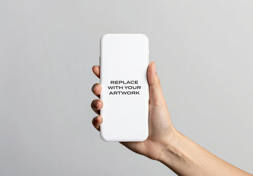 Smartphone screen mockup held in hand against neutral gray background, vertical mobile device display for branding, graphic design, advertising, and digital presentation