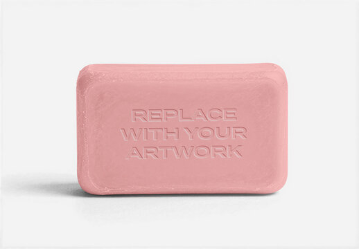 Rectangular soap bar mockup with embossed text area on a white surface, product presentation template for branding, packaging design, and advertising display, clean minimalist flat lay