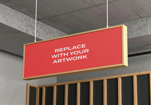 Wooden framed hanging sign mockup with red background and placeholder text, suspended from a concrete ceiling in modern interior wood paneling, Template