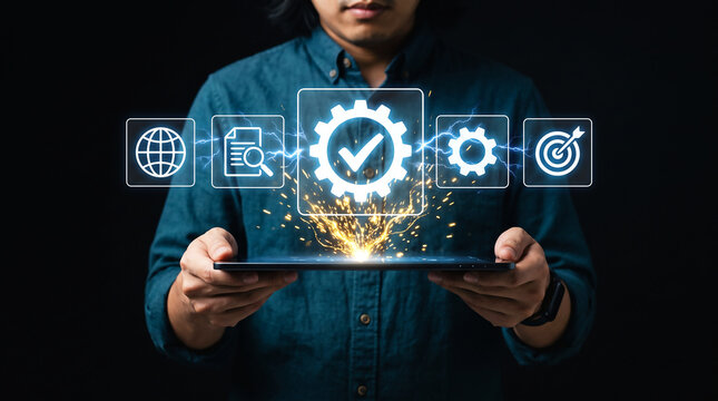 Businessman using tablet with quality assurance and business process optimization icons.