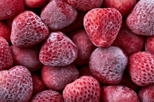 Frozen strawberries ready for use in recipes or snacks on a kitchen counter