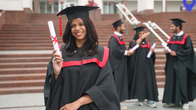 Happy indian female student celebrating graduation day