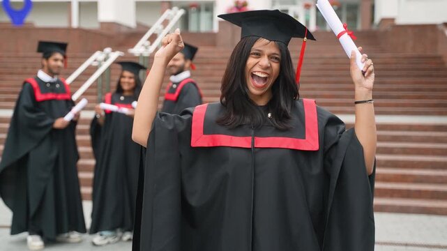 Happy indian female student celebrating graduation day