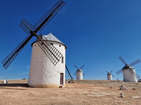 Iconic Spanish windmills standing on a dry hill in Campo de Criptana, Castilla-La Mancha