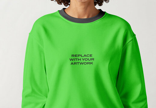 Crewneck sweatshirt mockup with black ribbed collar, front chest area featuring placeholder text for artwork, studio background, clothing branding presentation, wearable garment design template