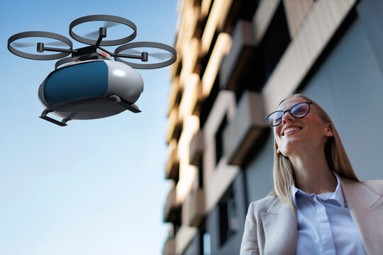 Businesswoman waiting for a flying taxi in a modern urban environment