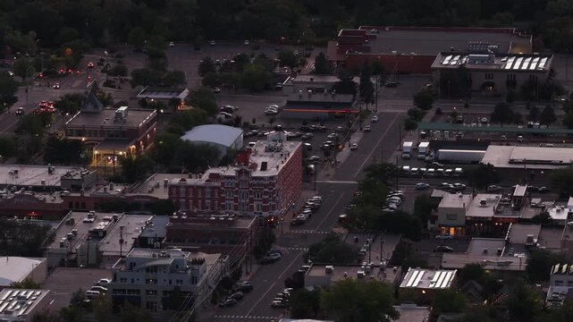 Aerial of downtown Durango Colorado commercial streetscape at evening with city lights in summer