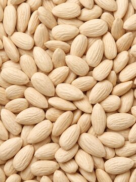 Vertical potrait of blanched almonds showing a natural seed pattern and organic food texture for health food packaging, culinary blogs, and dietary marketing campaigns.