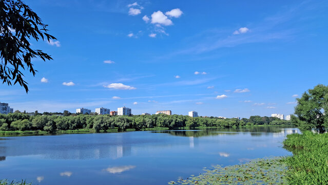 Urban lakeside landscape with calm reflections