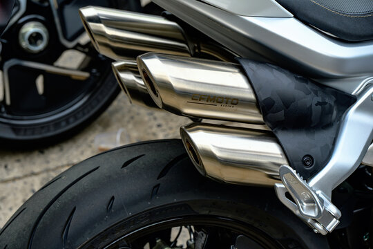 Racing exhausts with brushed metal finish and black camo heat shield