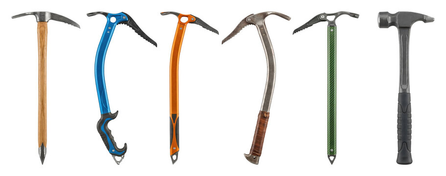 Five different ice axes and one hammer arranged in a neat row, showcasing a variety of designs from vintage wooden to modern technical climbing equipment