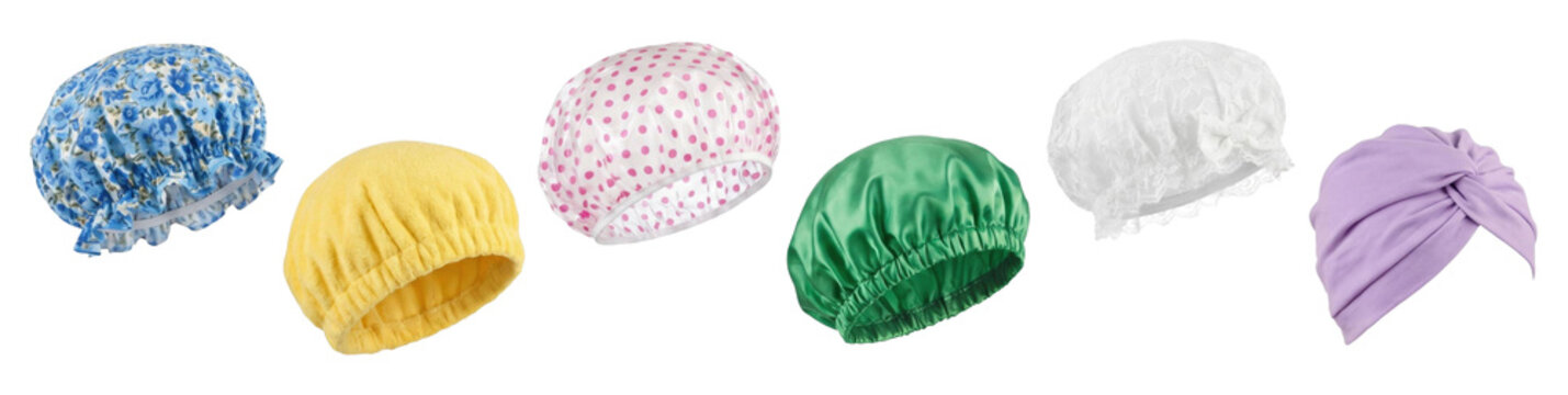 Collection of colorful shower caps and hair bonnets in various styles and materials, including satin, lace, and plastic, arranged as a diverse product assortment