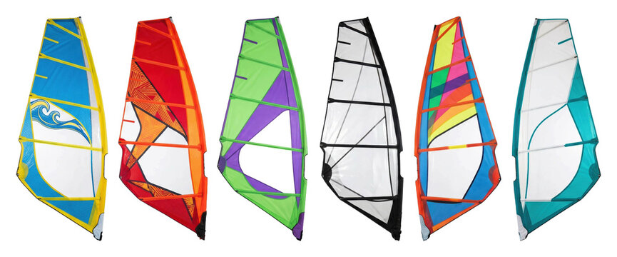Six colorful windsurfing sails with different vibrant designs and patterns are arranged in a straight line, showcasing a diverse collection of modern watersports equipment