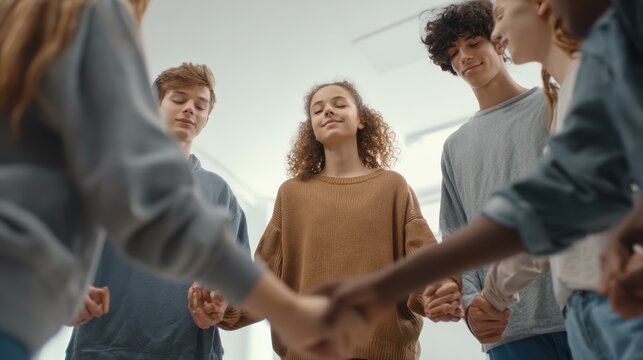 A diverse group of teenagers standing in a circle holding hands with a therapist, participating in a mindfulness exercise, eyes closed, peaceful expressions