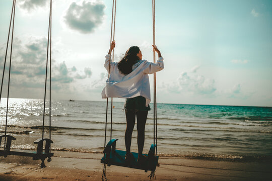 Carefree traveler feeling secure and protected while enjoying a dream vacation at a tropical beach