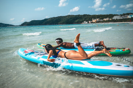Luxury beach resort vacation with young couple, tourist enjoying water activities on summer vacation