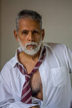 Relaxed Mature Man Leaning Side Portrait with Open Shirt