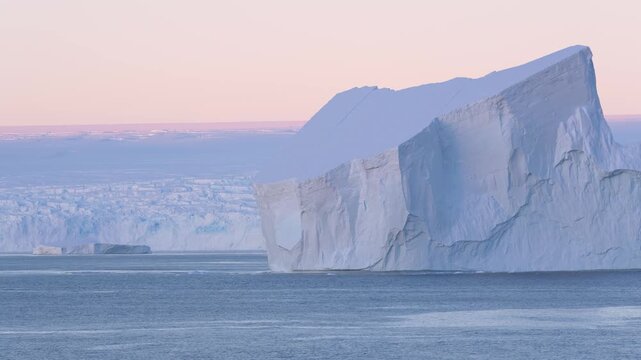 Antarctica Huge Tabular Icebergs at Sunset. Beautiful Snow Covered Mountains Epic Remote Nature Destination. Incredible Massive Ice Floating