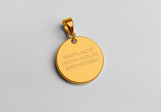Circular pendant mockup with engraved text placeholder on a textured white surface, jewelry branding presentation, customizable design template for product display and commercial marketing