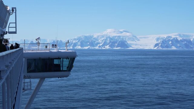 Antarctica Cruise Ship Side and Bridge with Stunning Landscape. Panorama of Mountains Covered in Snow, Ice, Glaciers. Wide Vista in Bismark Strait.