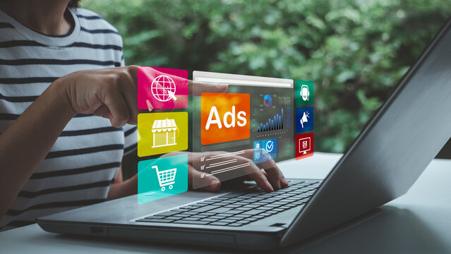 Digital advertising concept showing a person using a laptop with online ads, shopping, analytics, marketing, and media icons, representing ecommerce promotion, targeted campaigns, and business growth.