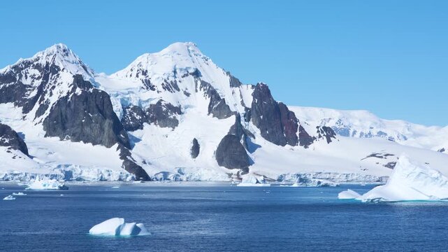 Antarctica Epic Landscape, Icebergs, Mountains Covered in Snow, Ice, Glaciers. Beautiful View From Cruise Ship in Bismark Strait Day. Floating Ice.