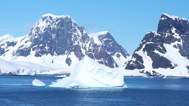 Antarctica Epic Landscape, Large Icebergs, Mountains Covered in Snow, Ice, Glaciers. Wide Vista Beautiful View From Cruise Ship in Bismark Strait Day.