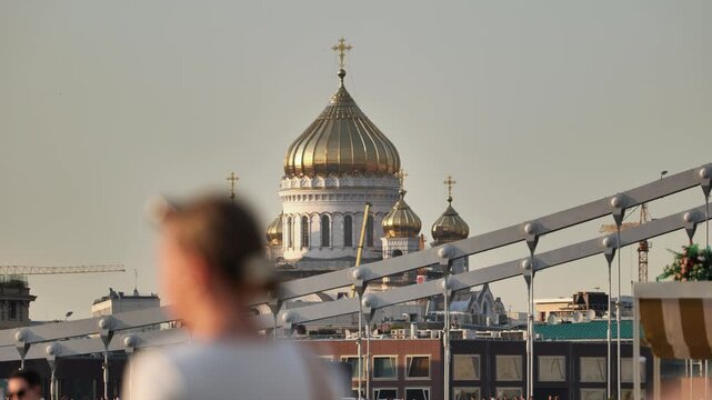 Cathedral of Christ the Saviour gold domes rising above a Moscow city skyline