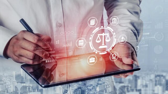 Professional Man Using Tablet with Legal Symbols and Digital Graphics Representing Justice and Law Concepts in a Modern Office Setting. Entropy.