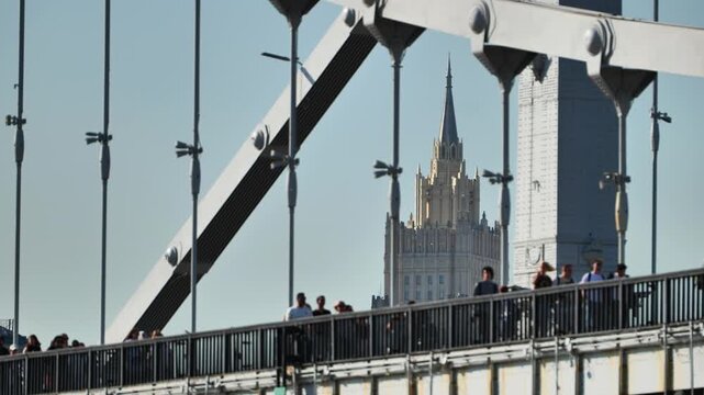 Ministry of Foreign Affairs building and Krymsky bridge with people in Moscow