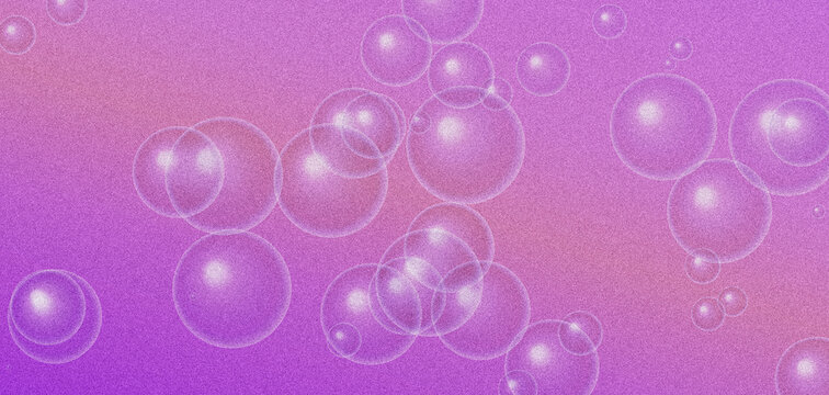 Transparent soap bubbles floating over vibrant pink and purple grainy background.