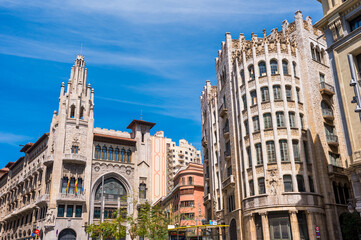 Obraz premium Two Historical Caixa Buildings in Barcelona City in Spain