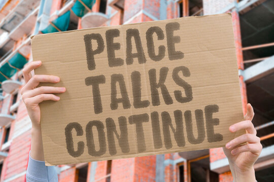 "peace talks continue" Diplomats work through unresolved issues. PEACE. TALKS. CONTINUE. DIPLOMATS. NEGOTIATION.