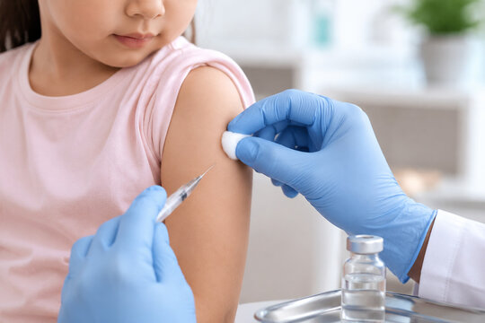 Child vaccination scene with cotton swab and vaccine vial, pediatric healthcare concept.
