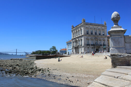 Ribeira das Naus Sandy Beach with Supreme Court Building Facade and Tagus River Waterfront View from Cais das Colunas in Lisbon, Historic City Center Travel Concept in Portugal