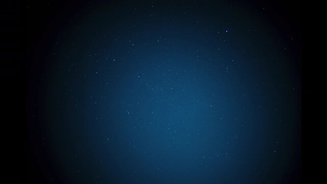 Night sky filling the frame with countless tiny stars twinkling in the dark blue expanse, creating an abstract background