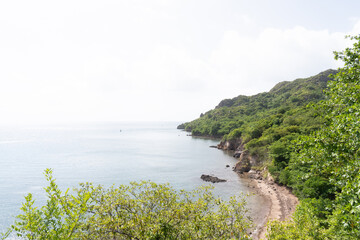 Obraz premium Curving tropical coast, green forest and calm sea at Santa Catalina, Colombia