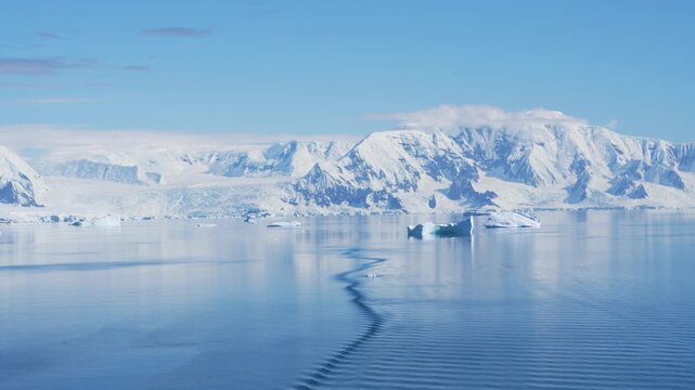 Antarctica Icebergs on Calm Waters in Bismarck Strait, Snow-Capped Mountain Range, Epic Beautiful Nature Polar Seascape and Glacial Landscape.