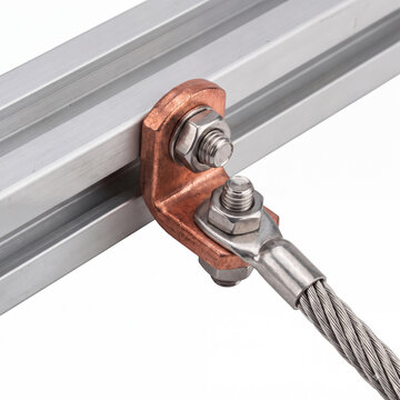 Generic solar panel mounting rail grounding lug bonding clamp isolated on white.