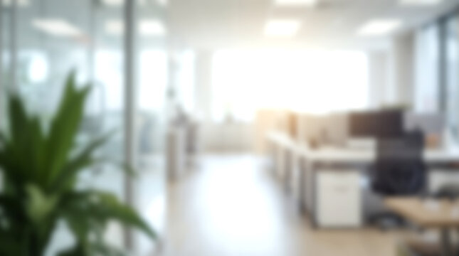 Blurred modern open plan office interior with desks and chairs.